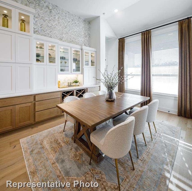 2507 Miranda Ln, Rockwall, TX 75087 - dining room with vaulted ceiling and light wood-type flooring