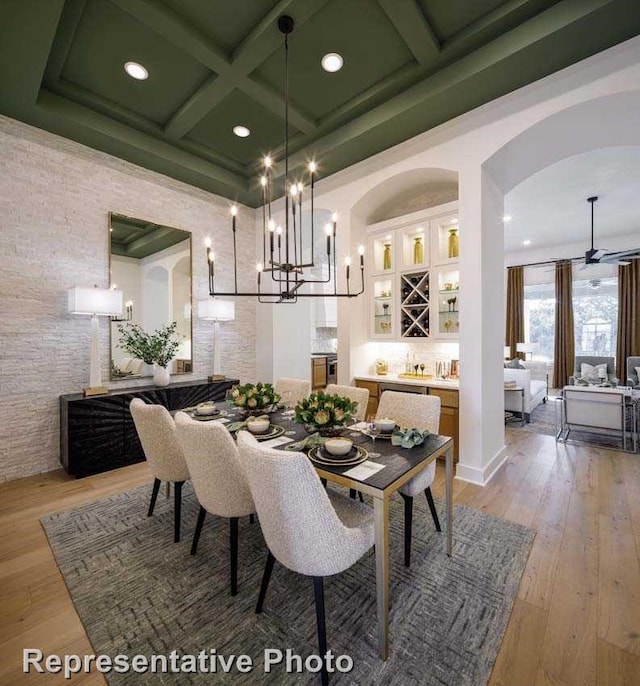 2507 Miranda Ln, Rockwall, TX 75087 - dining area with coffered ceiling, light wood-style flooring, recessed lighting, beamed ceiling, and arched walkways