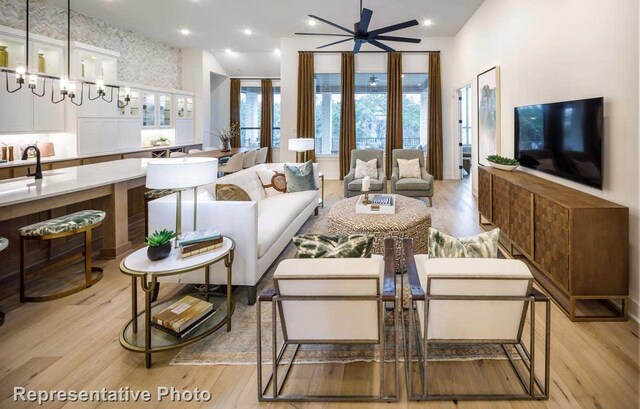 2507 Miranda Ln, Rockwall, TX 75087 - living area featuring light wood-style floors and a ceiling fan
