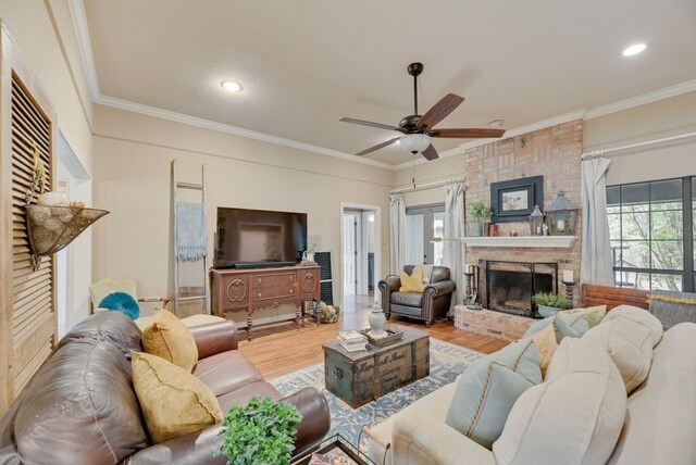 233 Shields Dr, Trophy Club, TX 76262 - living area with ceiling fan, wood finished floors, crown molding, a brick fireplace, and recessed lighting
