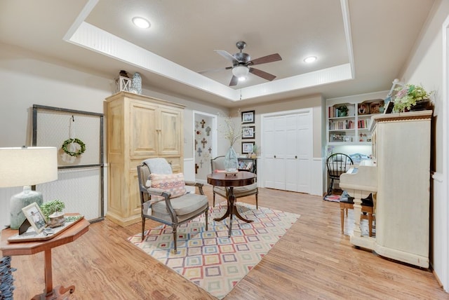 233 Shields Dr, Trophy Club, TX 76262 - sitting room with a tray ceiling, ceiling fan, light wood-style flooring, and recessed lighting