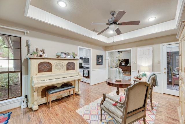 233 Shields Dr, Trophy Club, TX 76262 - dining space featuring a raised ceiling, a ceiling fan, wainscoting, light wood-style floors, and recessed lighting