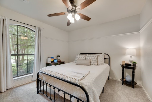 233 Shields Dr, Trophy Club, TX 76262 - bedroom featuring light colored carpet, multiple windows, baseboards, and a ceiling fan