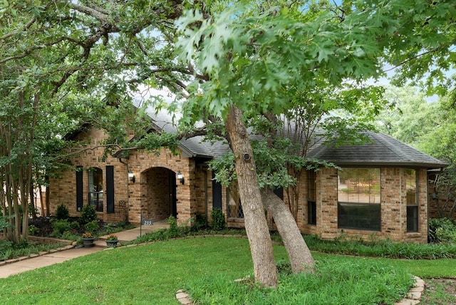 233 Shields Dr, Trophy Club, TX 76262 - view of front of property featuring brick siding, a front yard, and roof with shingles