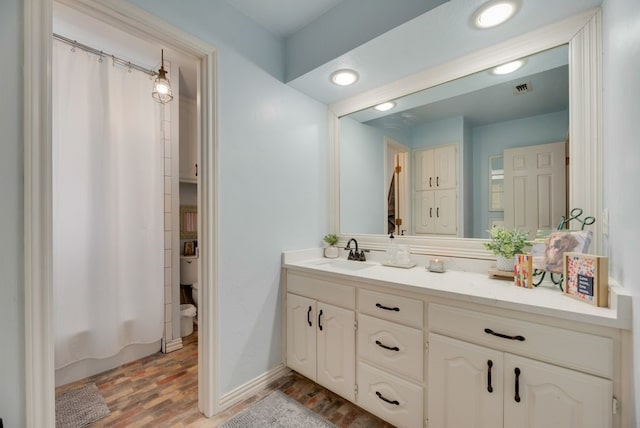 233 Shields Dr, Trophy Club, TX 76262 - full bathroom with vanity, wood finished floors, and shower / tub combo