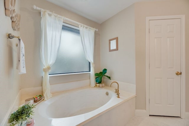 233 Shields Dr, Trophy Club, TX 76262 - bathroom featuring a garden tub and tile patterned flooring