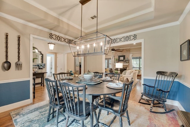 233 Shields Dr, Trophy Club, TX 76262 - dining area with wood finished floors, a ceiling fan, crown molding, and baseboards