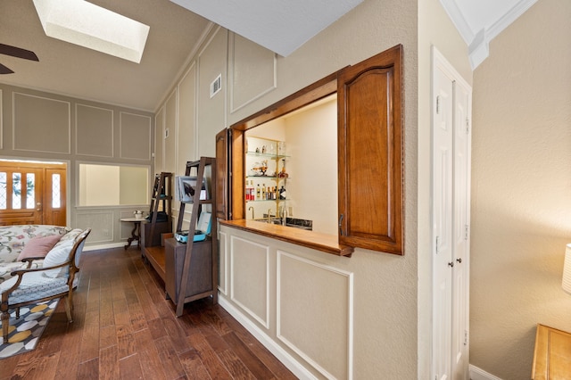 3907 Meadow Dr, Grapevine, TX 76051 - corridor featuring a skylight, dark wood finished floors, a decorative wall, and a textured wall