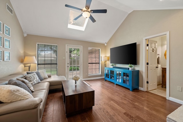 3907 Meadow Dr, Grapevine, TX 76051 - living area featuring a ceiling fan, lofted ceiling, wood finished floors, a skylight, and ornamental molding