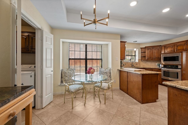 3907 Meadow Dr, Grapevine, TX 76051 - kitchen featuring stainless steel appliances, a raised ceiling, a chandelier, open shelves, and a peninsula