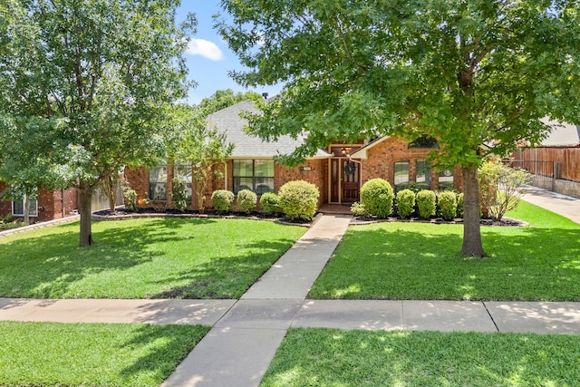3907 Meadow Dr, Grapevine, TX 76051 - obstructed view of property with brick siding and roof with shingles