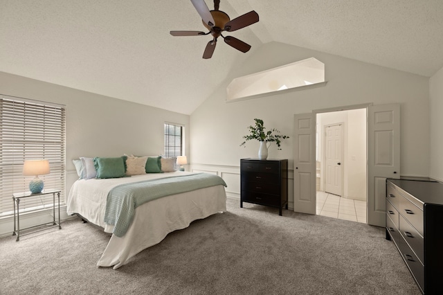 3907 Meadow Dr, Grapevine, TX 76051 - carpeted bedroom with a ceiling fan, high vaulted ceiling, and a textured ceiling