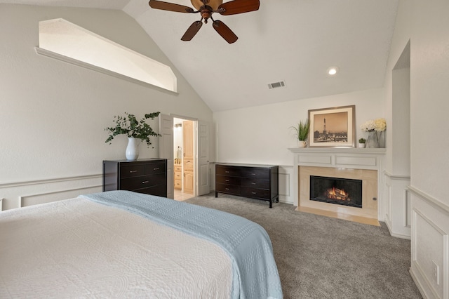 3907 Meadow Dr, Grapevine, TX 76051 - carpeted bedroom featuring vaulted ceiling, a fireplace with flush hearth, ensuite bathroom, a ceiling fan, and recessed lighting