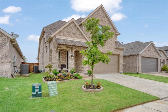 3913 Southbend Ct, Denison, TX 75020 - view of front of property featuring brick siding, central AC unit, concrete driveway, and a shingled roof