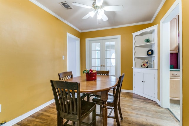 202 N St, Grand Prairie, TX 75050 - dining area with ceiling fan, ornamental molding, and light wood-style flooring