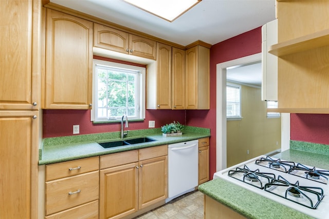 202 N St, Grand Prairie, TX 75050 - kitchen with white dishwasher, light brown cabinetry, light countertops, range with gas stovetop, and stovetop