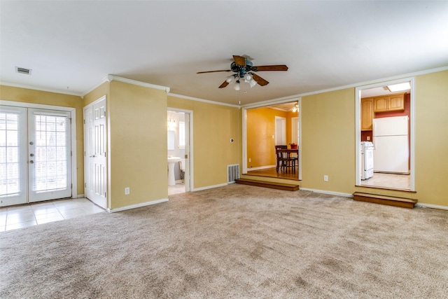 202 N St, Grand Prairie, TX 75050 - unfurnished living room with ceiling fan, crown molding, french doors, and light carpet