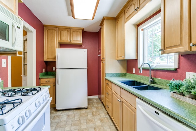202 N St, Grand Prairie, TX 75050 - kitchen with white appliances, light countertops, and light brown cabinetry