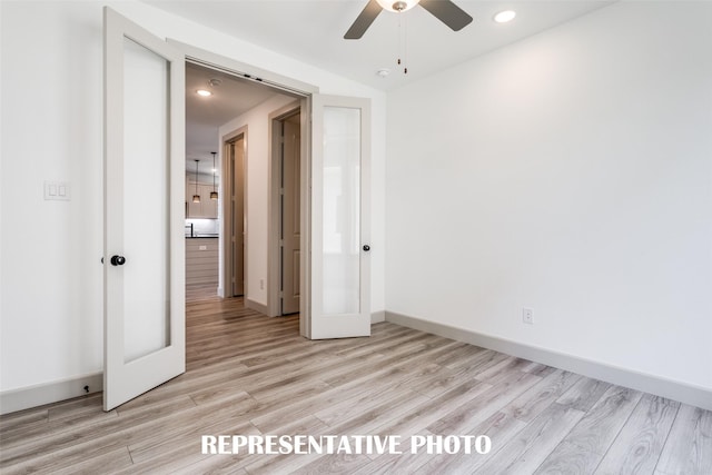 5609 Golden Sun Ln, Mckinney, TX 75070 - empty room featuring light wood-type flooring, ceiling fan, recessed lighting, baseboards, and french doors