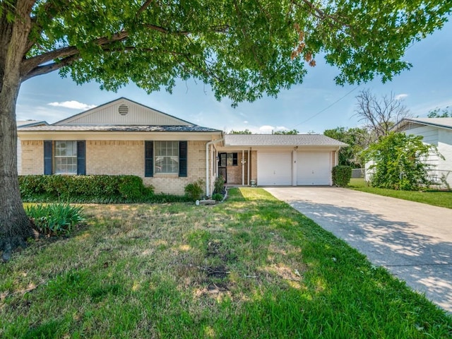 2504 W Rochelle Rd, Irving, TX 75062 - ranch-style house with an attached garage, brick siding, driveway, and a front yard