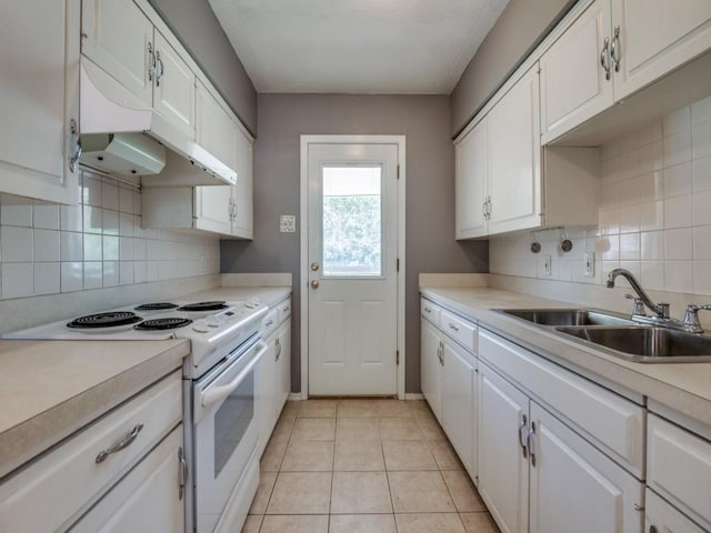 2504 W Rochelle Rd, Irving, TX 75062 - kitchen with electric range, a sink, white cabinets, and backsplash
