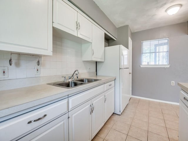 2504 W Rochelle Rd, Irving, TX 75062 - kitchen featuring a sink, white cabinets, and light countertops
