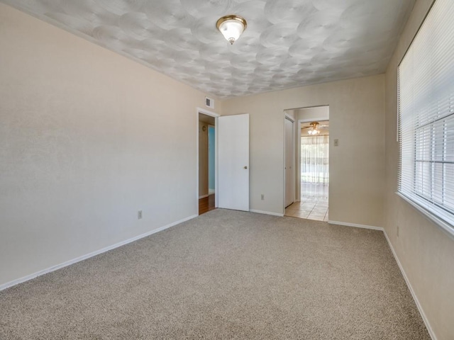 2504 W Rochelle Rd, Irving, TX 75062 - unfurnished room featuring light colored carpet and baseboards