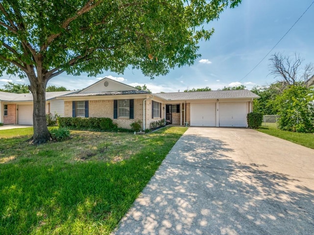 2504 W Rochelle Rd, Irving, TX 75062 - ranch-style house with a garage, driveway, and brick siding