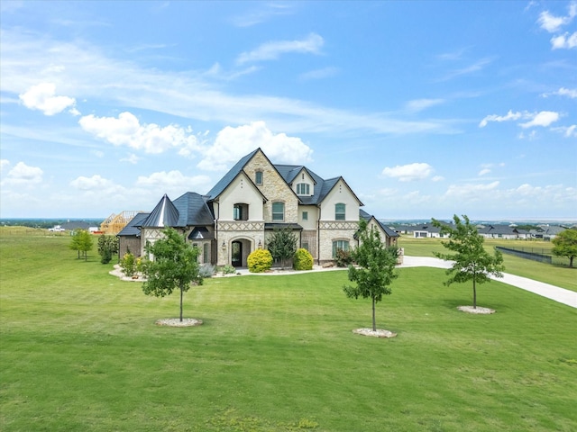 212 Nueces Trl, Aledo, TX 76008 - french country home featuring stone siding, a front yard, a standing seam roof, and metal roof