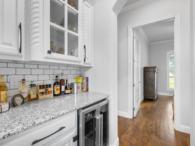 212 Nueces Trl, Aledo, TX 76008 - indoor dry bar featuring wine cooler, crown molding, backsplash, dark wood-type flooring, and baseboards
