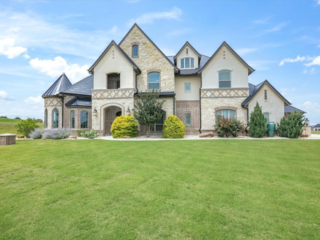 212 Nueces Trl, Aledo, TX 76008 - french country inspired facade with stucco siding, a front lawn, and stone siding