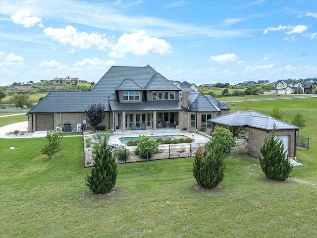 212 Nueces Trl, Aledo, TX 76008 - back of house with an attached garage, brick siding, and a patio