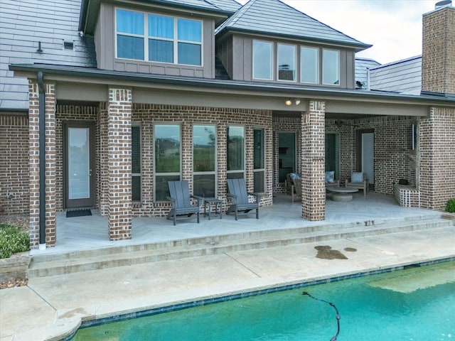 212 Nueces Trl, Aledo, TX 76008 - back of property featuring a patio area, brick siding, and an outdoor pool