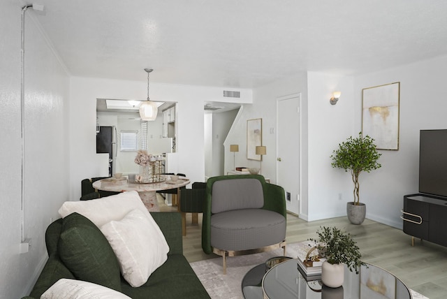 4557 N O Connor Rd Unit 1285, Irving, TX 75062 - living area featuring light wood-style flooring and baseboards
