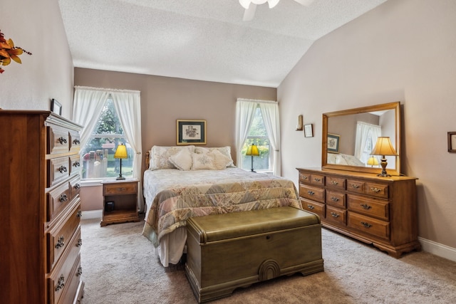 202 Yosemite Dr, Mansfield, TX 76063 - carpeted bedroom with a textured ceiling, lofted ceiling, baseboards, and ceiling fan