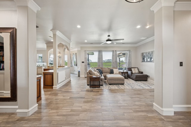 872 Hidden Pass, Royse City, TX 75189 - living area with recessed lighting, ornamental molding, a ceiling fan, light wood finished floors, and decorative columns