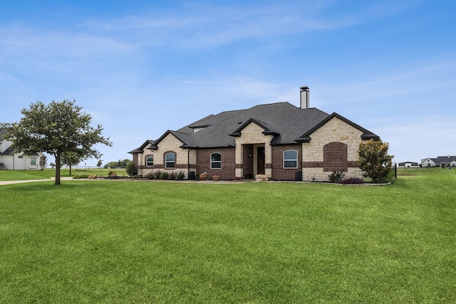 872 Hidden Pass, Royse City, TX 75189 - french country style house featuring a front yard, a chimney, and a shingled roof