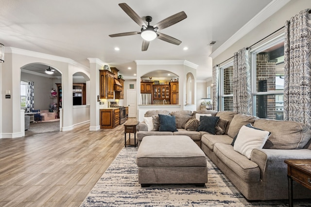 872 Hidden Pass, Royse City, TX 75189 - living area featuring arched walkways, crown molding, a ceiling fan, light wood finished floors, and recessed lighting