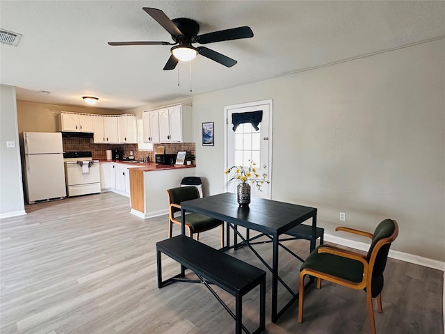 3007 Gaines St, Bossier City, LA 71111 - dining room with baseboards, ceiling fan, and light wood finished floors