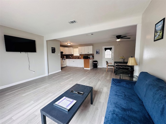 3007 Gaines St, Bossier City, LA 71111 - living room with light wood-style floors, baseboards, and ceiling fan