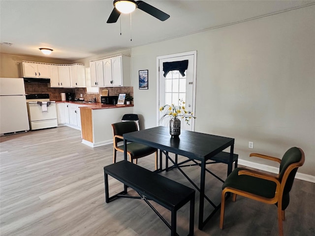 3007 Gaines St, Bossier City, LA 71111 - dining room featuring light wood-style flooring, ceiling fan, and baseboards