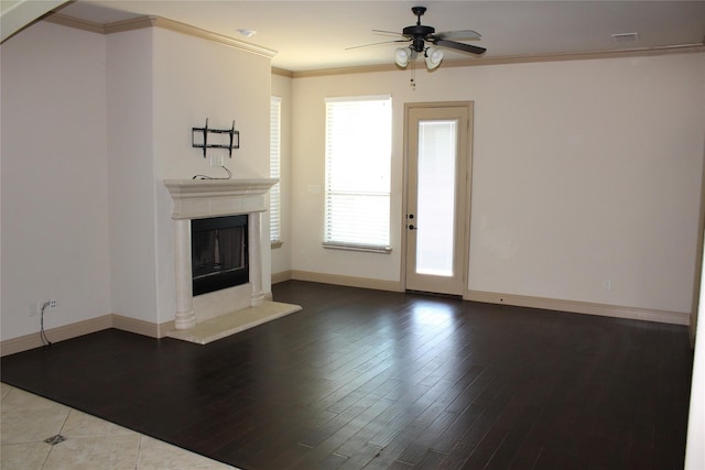 16324 Toledo Bend Ct, Prosper, TX 75078 - unfurnished living room featuring ceiling fan, a fireplace, baseboards, dark wood-style flooring, and crown molding