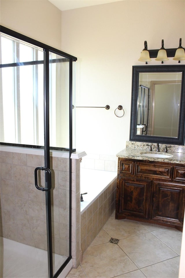 16324 Toledo Bend Ct, Prosper, TX 75078 - full bath featuring a bath, vanity, a stall shower, and tile patterned floors