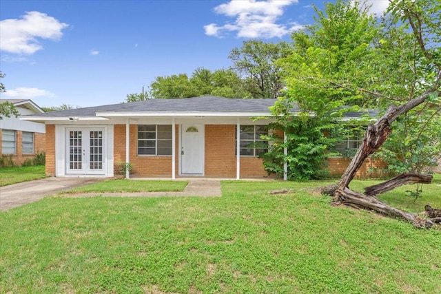 311 S Barbara, Waco, TX 76705 - single story home with french doors, brick siding, and a front lawn
