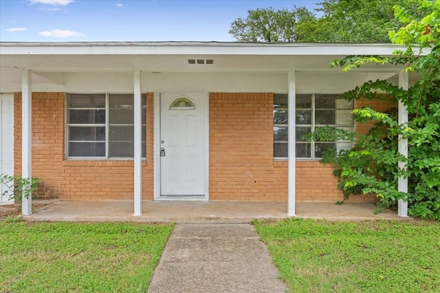 311 S Barbara, Waco, TX 76705 - doorway to property with brick siding and covered porch