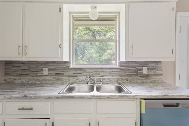 311 S Barbara, Waco, TX 76705 - kitchen featuring dishwasher, a sink, white cabinetry, tasteful backsplash, and light countertops