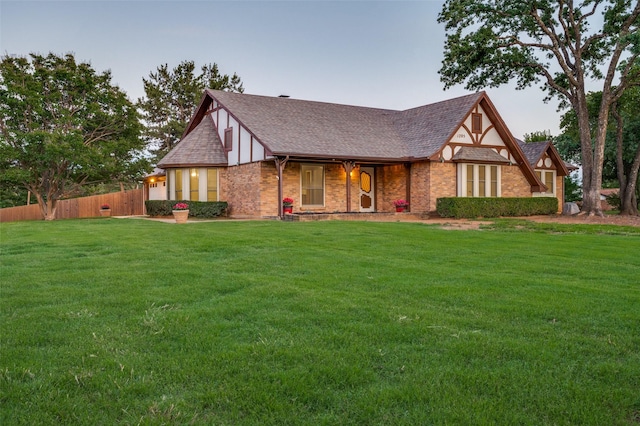 1205 Mount Gilead Rd, Keller, TX 76262 - tudor house with a shingled roof, brick siding, and covered porch