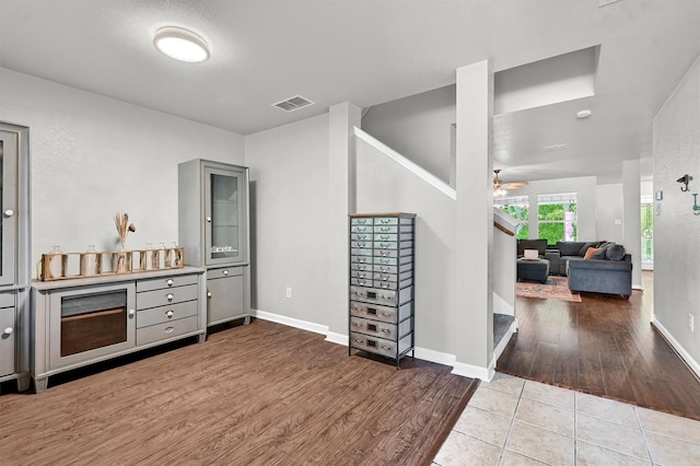 1509 Timberline Ct, Sherman, TX 75092 - bar featuring stairway, wood finished floors, baseboards, and a ceiling fan
