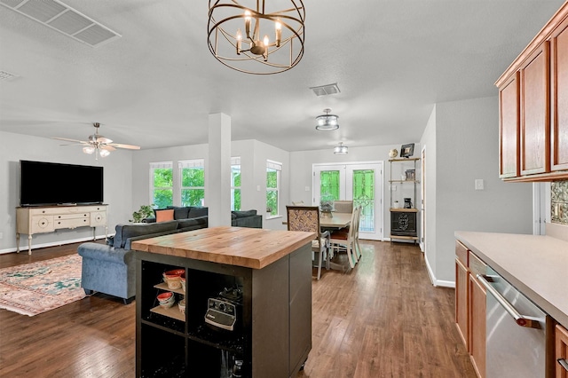 1509 Timberline Ct, Sherman, TX 75092 - kitchen with wooden counters, stainless steel dishwasher, dark wood-style flooring, ceiling fan, and a chandelier