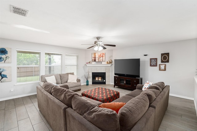 303 Highland Glen Dr, Wylie, TX 75098 - living room with ceiling fan, baseboards, wood finished floors, and a fireplace